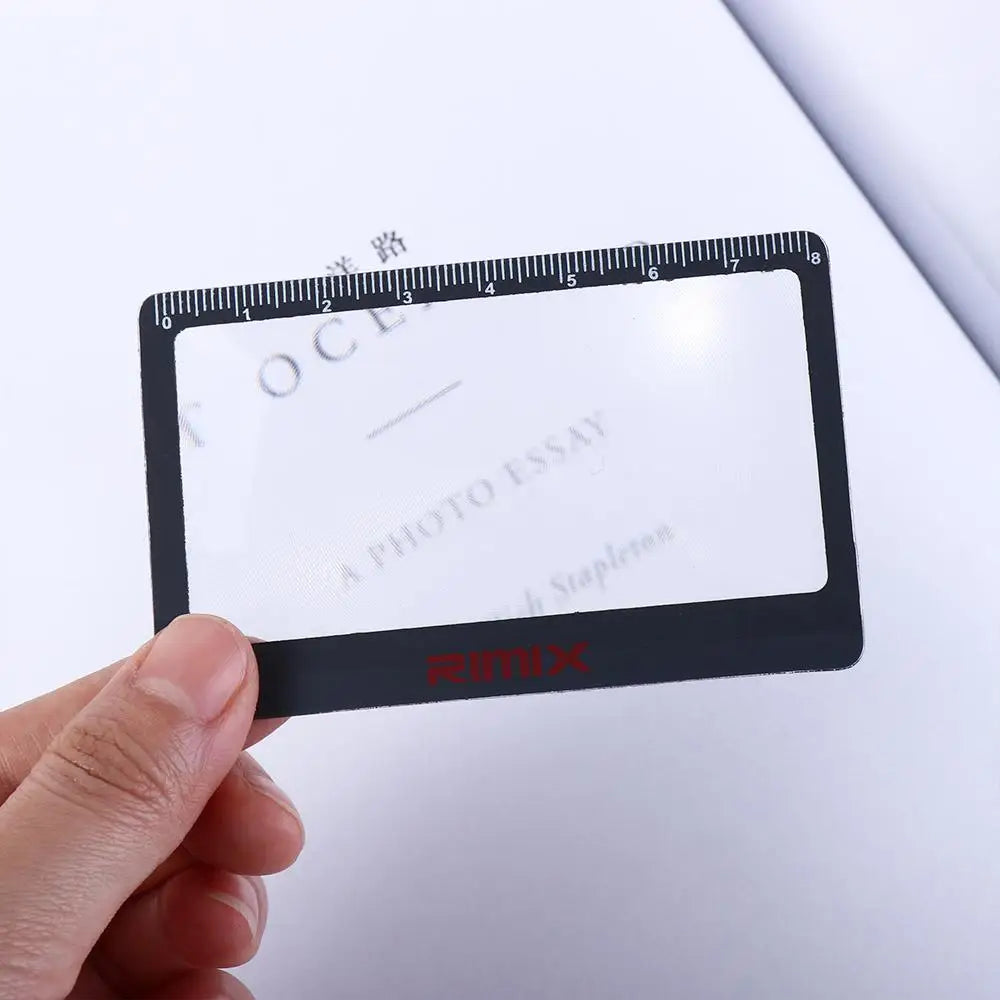 Black Magnifying Glass on book
